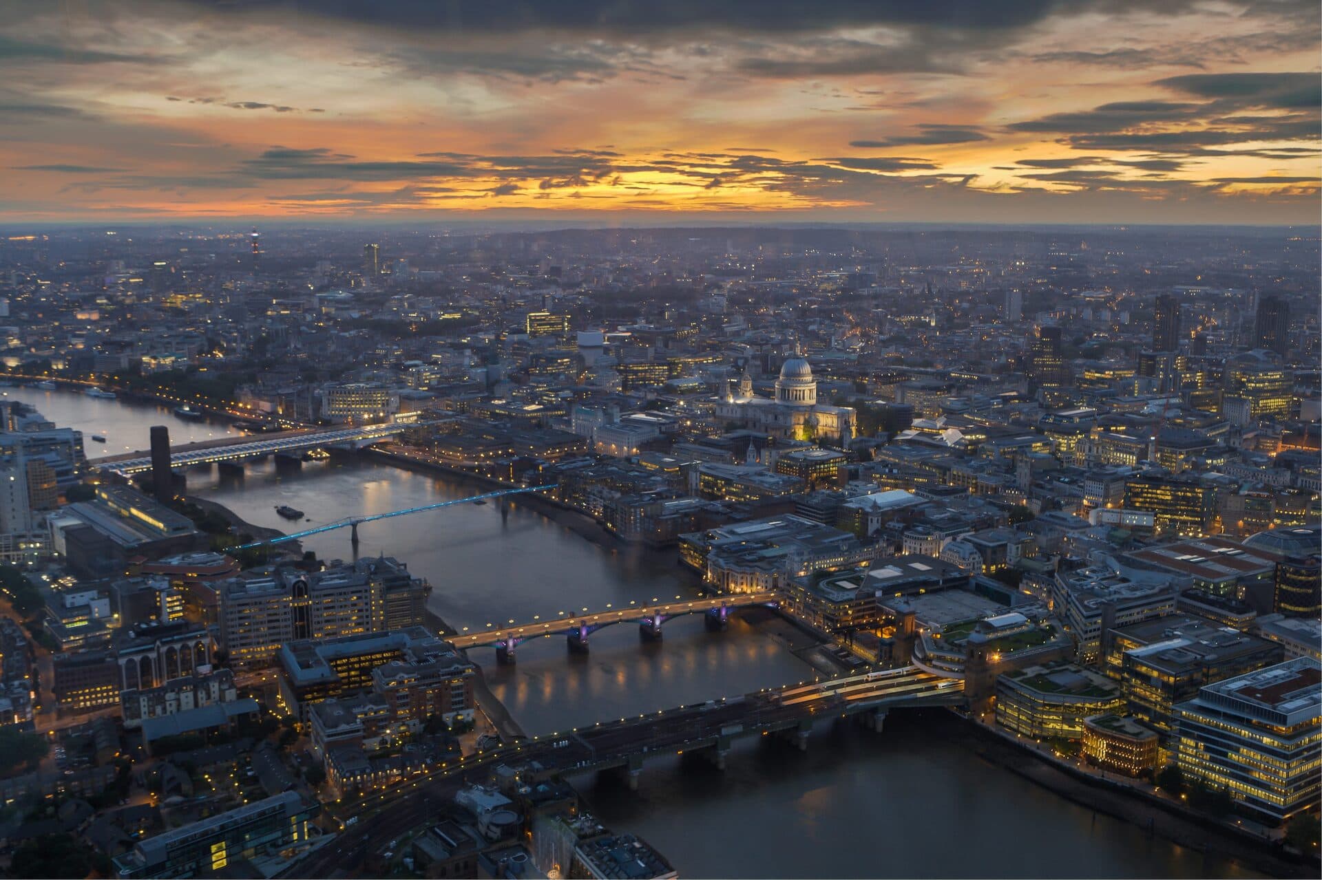 Aerial view of the City of London and the River Thames at sunset
