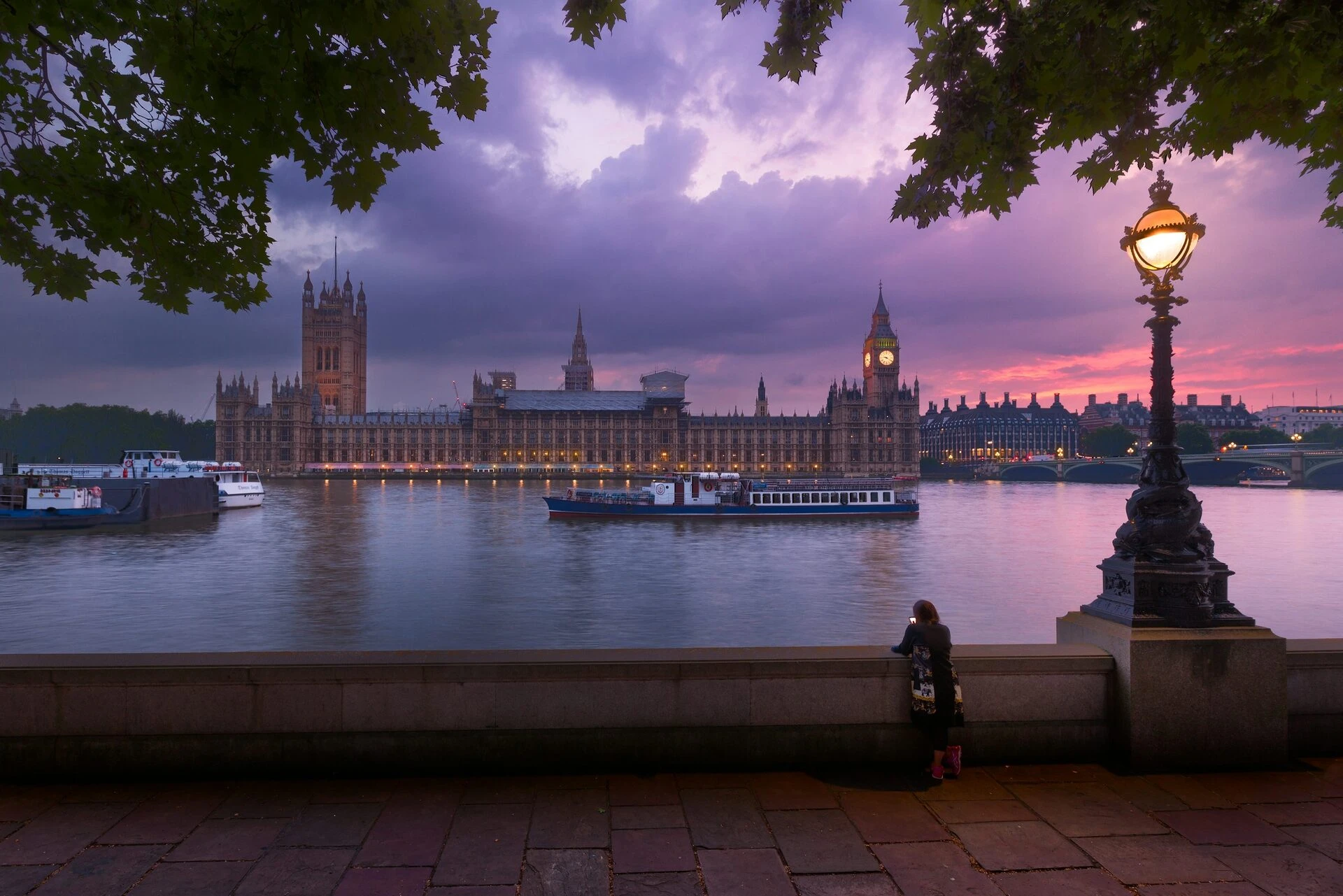 The Houses of Parliament and Big Ben across the River Thames at dusk